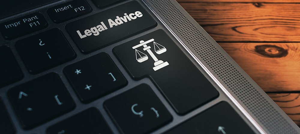 banner-laptop-keyboard-with-legal-advice-button-balance-justice-law-defense-concept